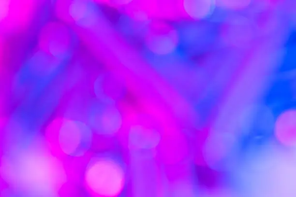 Photo of Bokeh with multi colors dots. Festive blue lights bokeh background. Defocused bokeh lights. Blurred bokeh. Light vintage background. Abstract colorful defocused pink dot. Soft focus