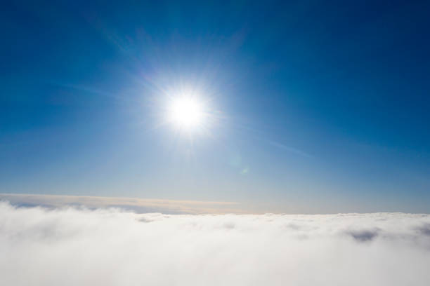 istock Aerial panorama view white clouds in blue sky. View from drone. Aerial top view cloudscape. Texture of clouds. View from above. Sunrise or sunset over clouds. Panoramic clouds 1214025402