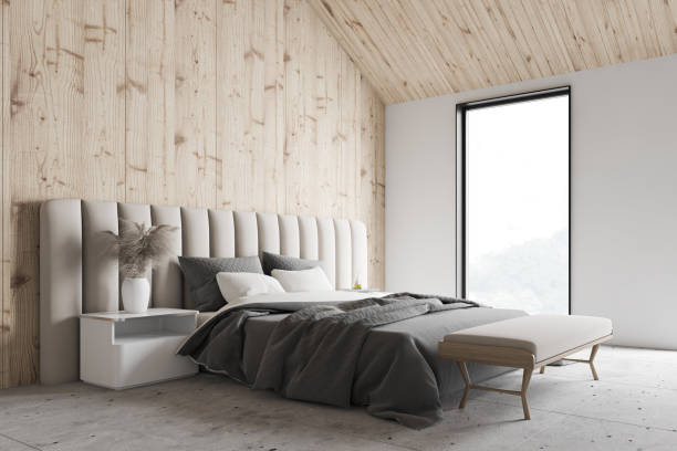 istock Wooden and white attic bedroom interior 1214026358
