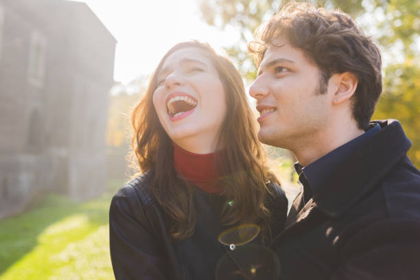 istock young couple lovers outdoor back light having fun 1214030654