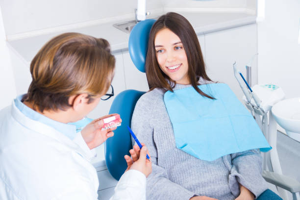 istock Young female woman patient examing teeth at dentist office 1214031868