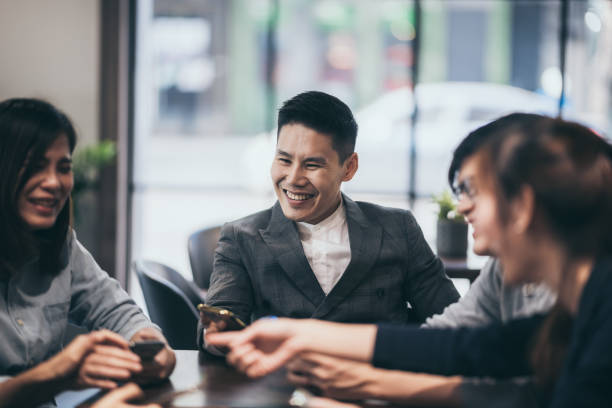 istock business people using smartphone at meeting table 1214032413