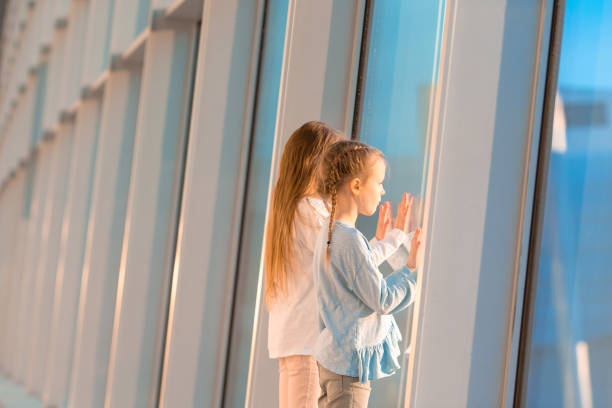 istock Little kid in airport waiting for boarding 1214033787