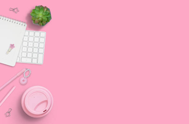 istock Flat layout of workplace on pink background 1214035073