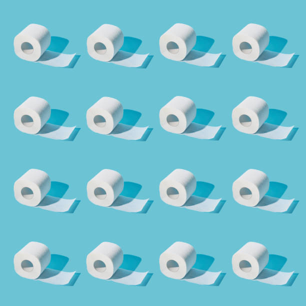istock Seamless patterns. white soft toilet paper on cyan background 1214035195