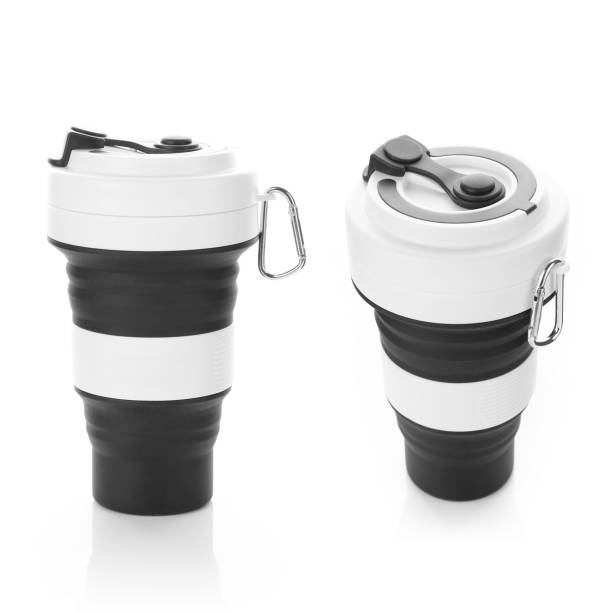istock Black Trendy Silicon Collapsible Cup with Metal Handle. Environmental Friendly Reusable Mug Isolated on White Background. For Hot and Cold Beverages. 1214039789