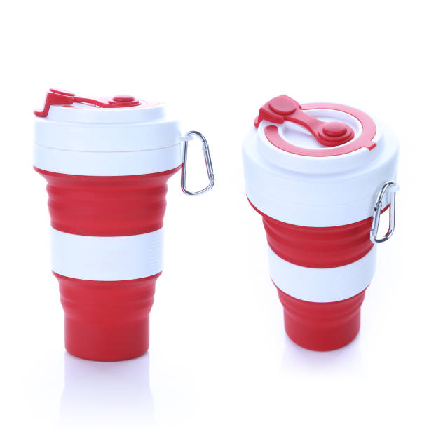 Lush Lava Red Trendy Silicon Collapsible Cup with Metal Handle. Environmental Friendly Reusable Mug Isolated on White Background. For Hot and Cold Beverages.