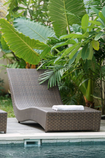 istock Swimming pool with deck chair outdoors at sunny day 1214040643