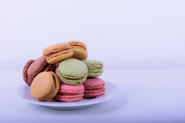 istock Colorful macaroons cake, sweet macaroon on white table background, food background 1214040944