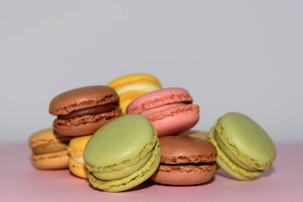 istock Colorful macaroons cake, sweet macaroon on white table background, food background 1214040975
