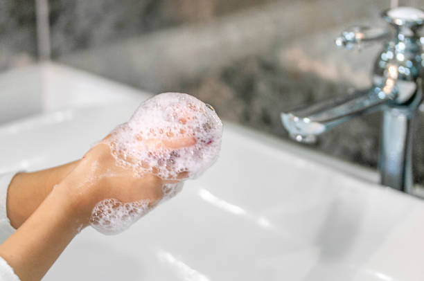 istock Little girl washing hands 1214042035