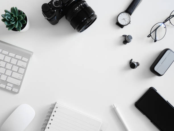 istock top view of work from home concept with calculator, notebook, plastic plant, smartphone and keyboard on white background, graphic designer, Creative Designer concept. 1214043263