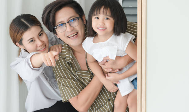 istock Parents playing with children in the bedroom 1214044583