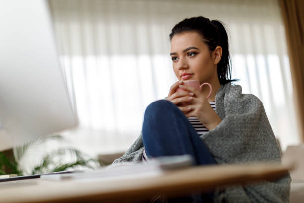 istock Young woman drinking morning coffee at home 1214046280