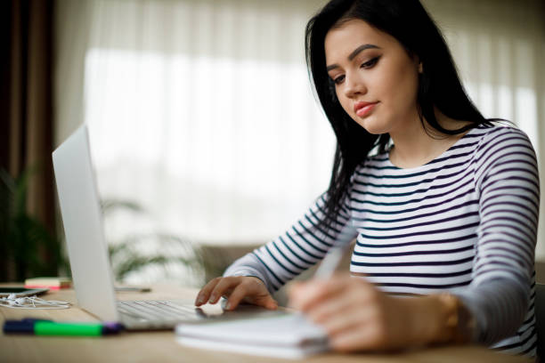 istock Young woman working at home 1214046297