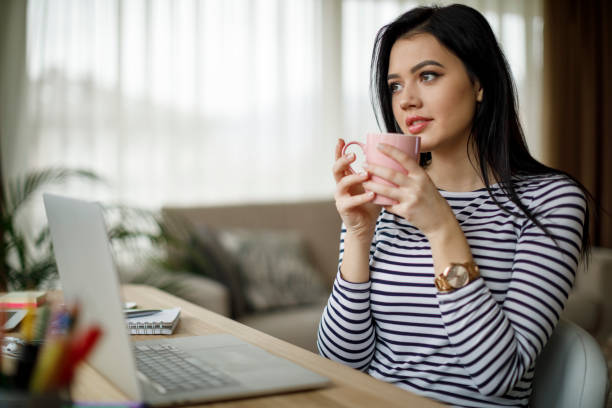istock Young woman enjoying her morning coffee 1214046484