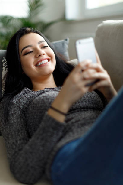 istock Young woman enjoying a relaxing weekend at home 1214046665