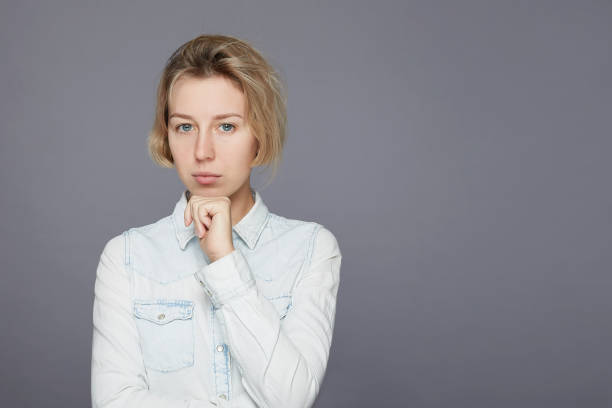 istock Young blond Caucasian female posing in studio 1214047119