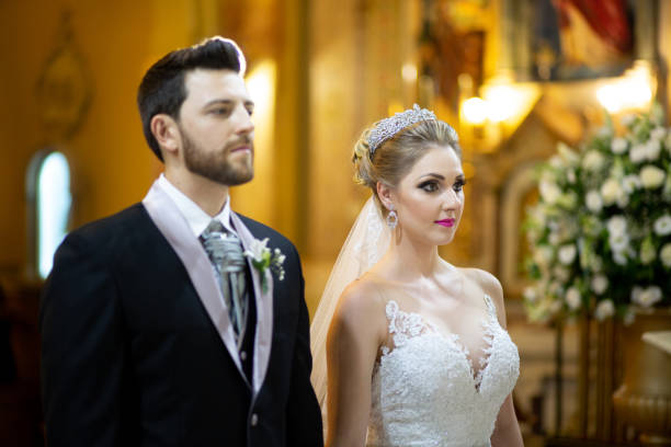 Beautiful young couple having an orthodox church wedding ceremony.