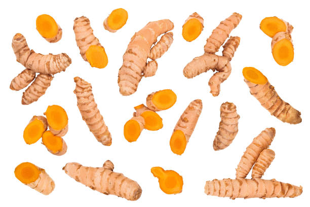 istock turmeric root and slices isolated on white background. Top view. Flat lay 1214048193