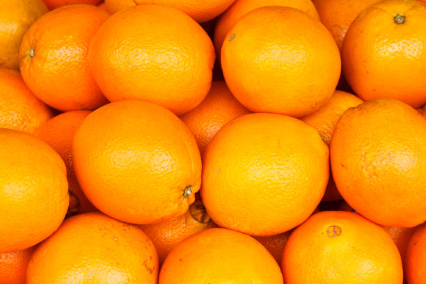 Oranges Close up view of fresh navel oranges. navel orange photos stock pictures, royalty-free photos & images