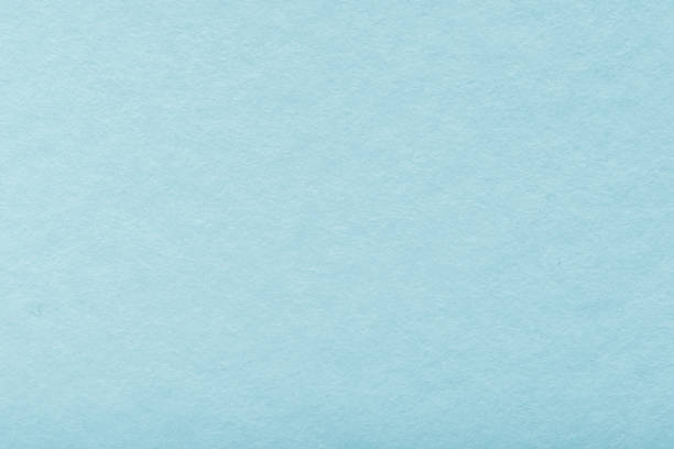 istock blank old blue paper texture background. Structure of dense turquoise cardboard, large detailed macro closeup 1214050221