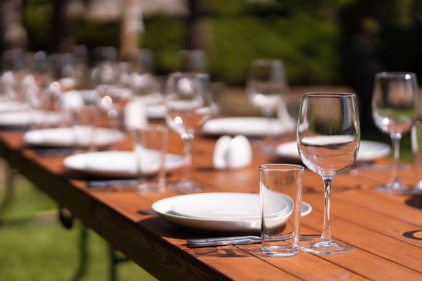 istock Served wooden table without a tablecloth. Cafe in the open air park 1214050871