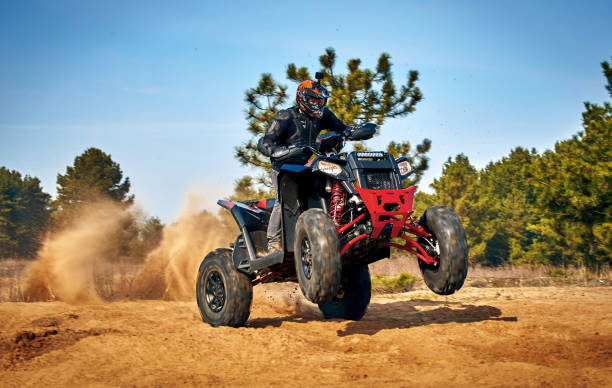 istock Racing in the sand on a four-wheel drive quad. 1214050931