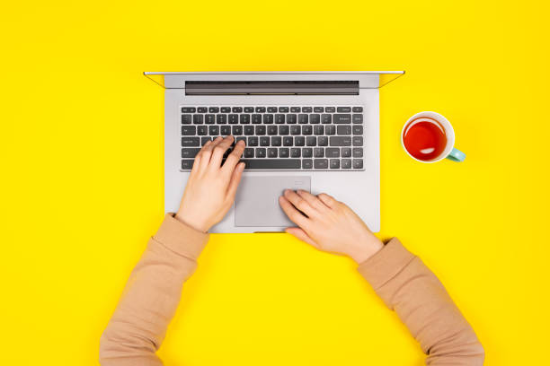 istock Person working on a laptop computer in a modern space. Home Office concept. 1214051131