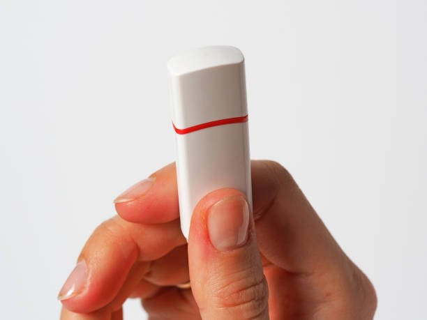 istock The girl is holding an white usb flash drive 1214052542