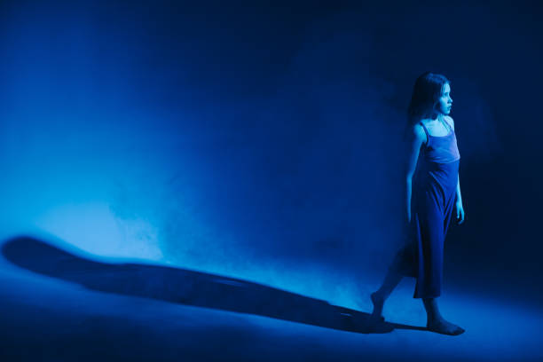 istock Young stylish girl dancing in the Studio on a colored neon background. Classic dancer. 1214054881