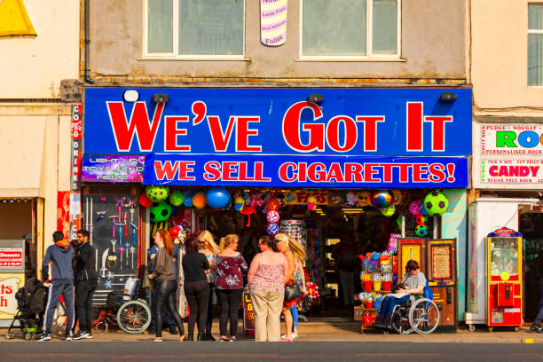 people in front of a supermarket on the boulevard of Blackpool stock photo