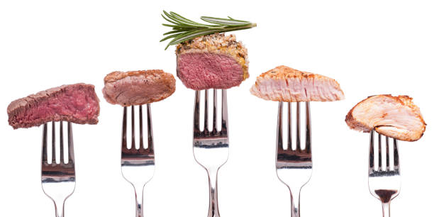 istock Display of roasted meat on a fork white isolated 1214055205