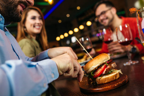 istock Eating burger in restaurant 1214055776