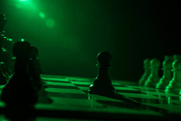 istock Chess figures on a dark background with smoke and fog. Selective focus 1214058613