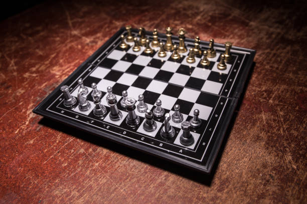 istock Chess figures on a dark background with smoke and fog. Selective focus 1214058641