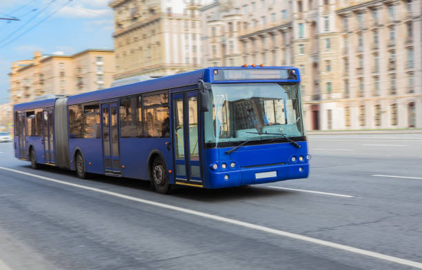 istock bus goes along street. blurred motion 1214058717