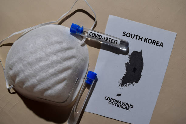istock Corona Virus outbreak with South Korea map printed on paperwork. Vaccine Covid-19 Test isolated on office desk. Awareness Prevention. Medical concept 1214063661
