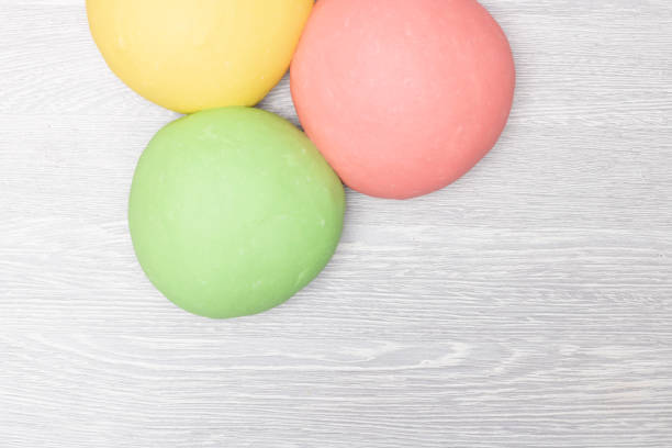 istock Red, green and yellow dough on table 1214063792