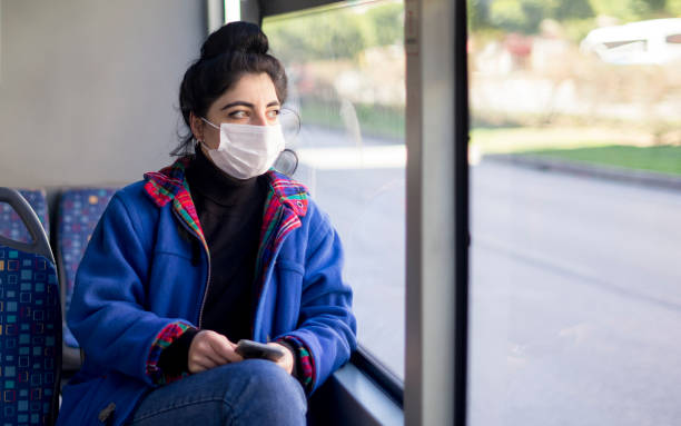 istock Bus transportation protective face mask woman 1214064530