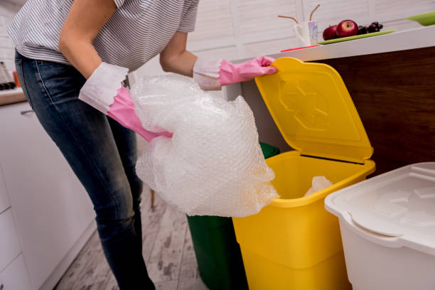 istock Young girl sorting garbage at the kitchen. Concept of recycling. Zero waste 1214064539