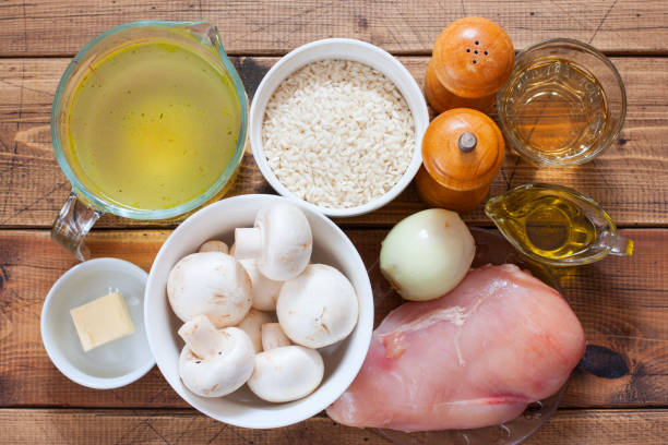 istock Step by step preparation of risotto with mushrooms and chicken breast, step 1 - preparation of the necessary ingredients, top view, selective focus 1214064748