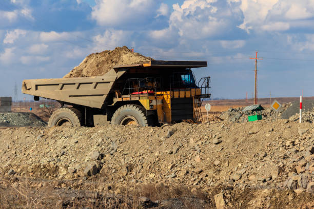 istock Huge yellow mining dump truck working in iron ore quarry. Mining industry 1214065039