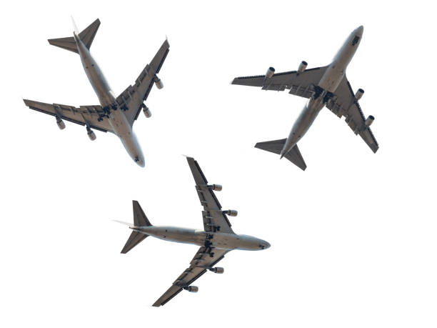 istock Jet passenger plane silhouettes isolated on white. Four engine aircrafts 1214065099