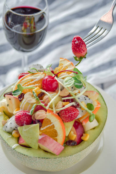 istock Fruit salad. Fresh Fruit Salad in Cantaloupe Bowl. 1214065958