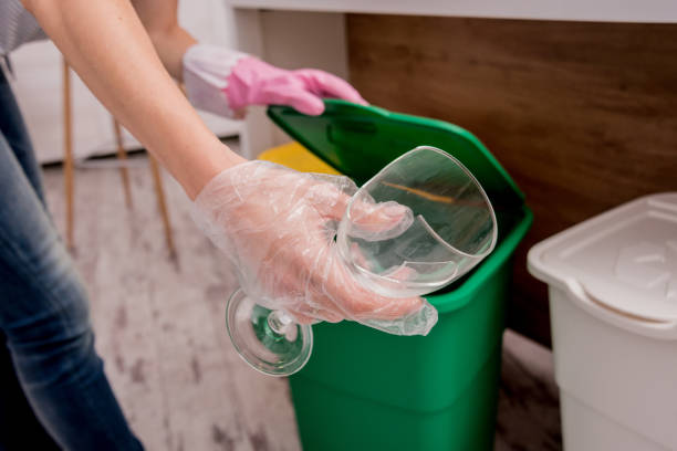 istock Young girl sorting garbage at the kitchen. Concept of recycling. Zero waste 1214066374