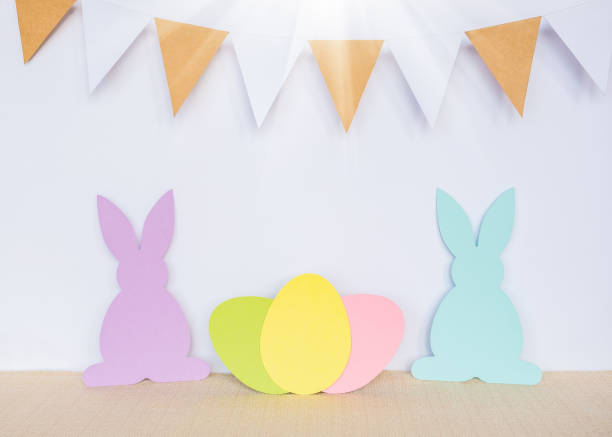 istock Easter background with eggs, rabbits and garland flags 1214067538