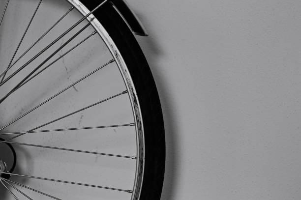 istock Bicycle wheel against a dirty wall in the garage (Pesaro, Italy, Europe) 1214067676