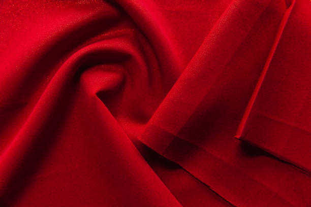 istock Beautiful fabric of one color is folded on a table 1214067695