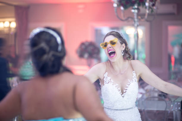 Bride and wedding guest dancing during wedding